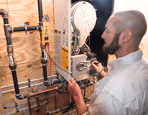 RSC technician performing heat system maintenance.